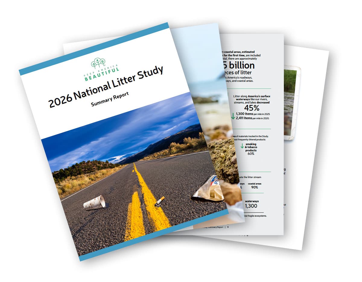 The 2026 National Litter Study Summary Report fanned open: its cover shows a paper cup, a cigarette butt and a wrapper on a desert highway’s center line, and the pages behind it carry the study’s headline figures.